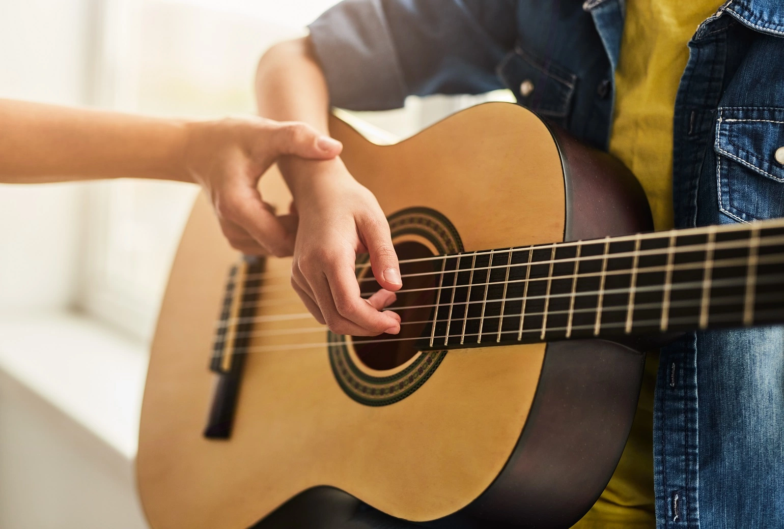Learning an instrument: When should one start playing the guitar?